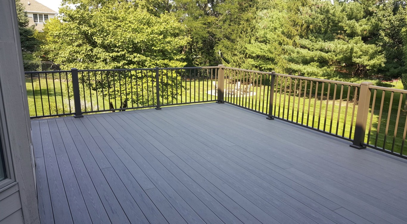 Gray composite deck with modern black railings in Poinciana, FL